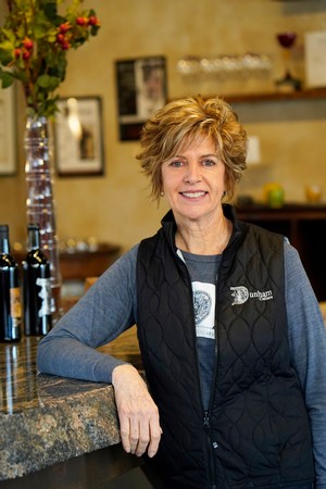 Photo of winery owner, Joanne Dunham, in the Dunham Cellars tasting room